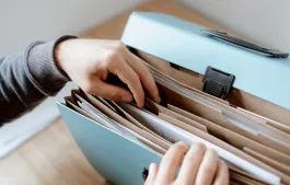 Person choosing document in folder